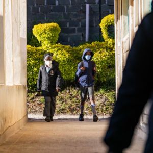 Pupils proudly walking into the school corridors, ready to start the day.