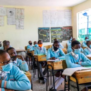Pupils listen intently as the teacher teaches in class.
